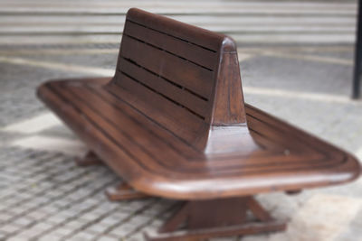 Close-up of empty bench on table