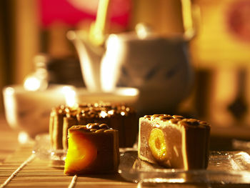 Close-up of sweet food with tea on table
