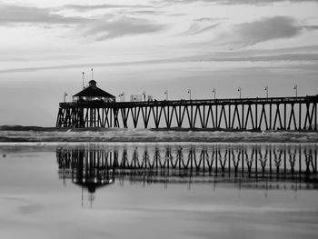 Pier over sea against sky