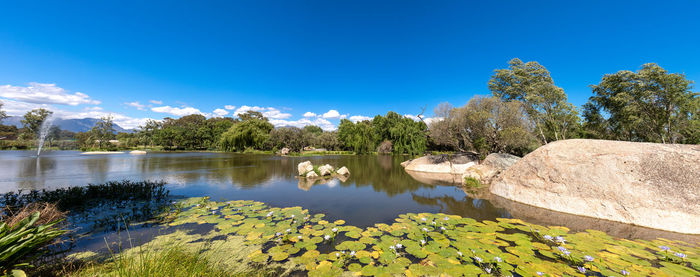 Scenic view of lake against blue sky