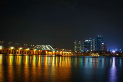 Illuminated city buildings at night