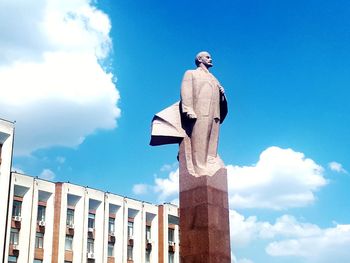 Low angle view of statue against blue sky