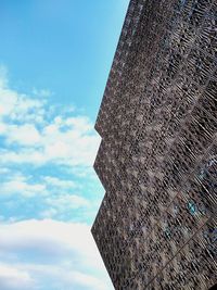 Low angle view of building against cloudy sky