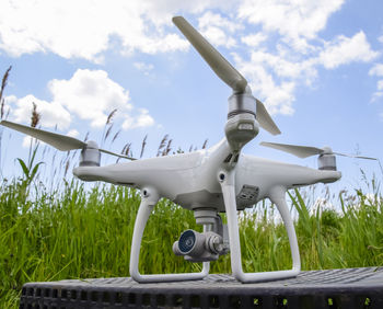 Close-up of airplane against sky