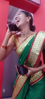 Midsection of a smiling young woman