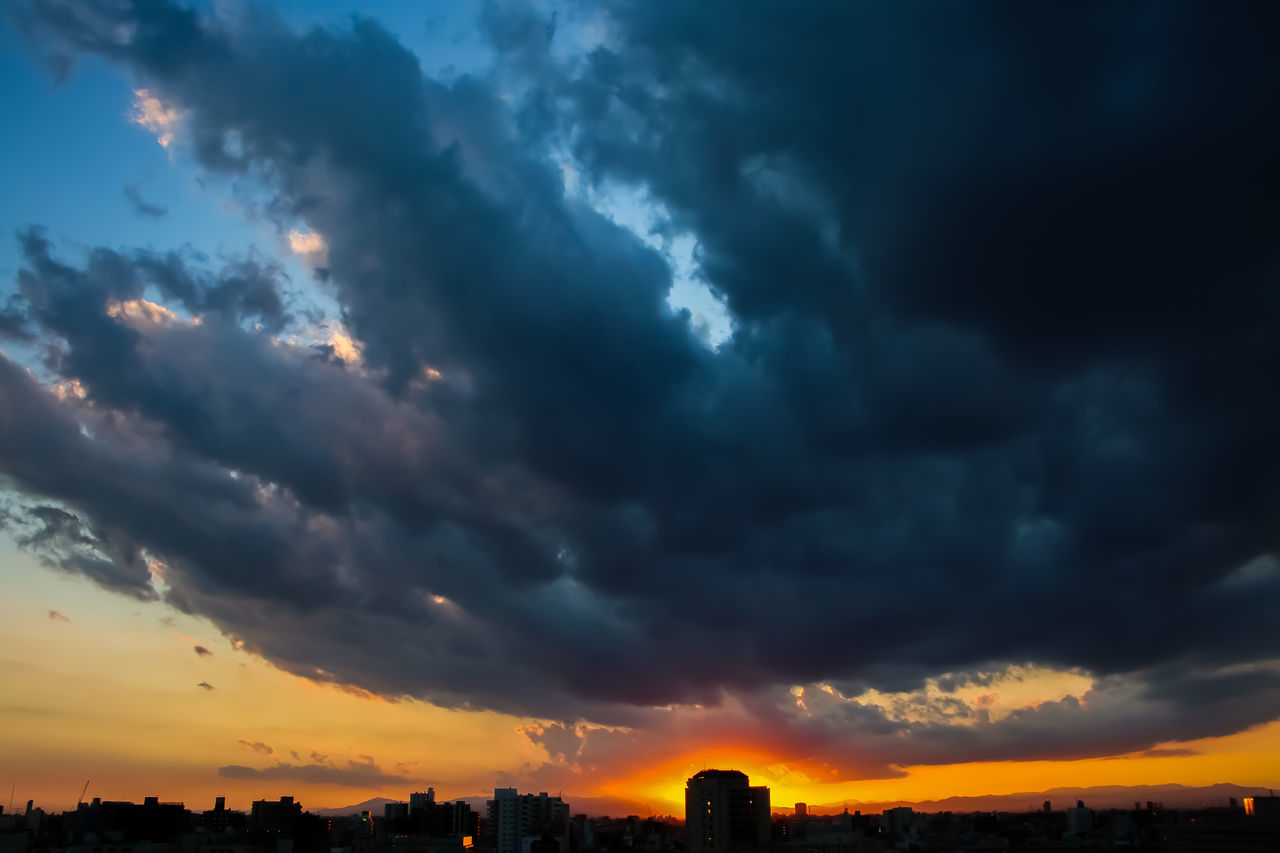 STORM CLOUDS OVER CITY