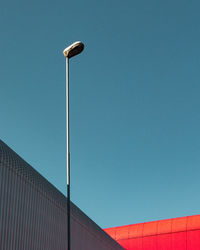 Low angle view of street light against sky