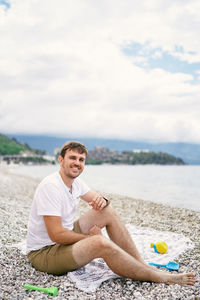 Woman sitting on beach