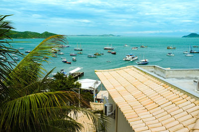 High angle view of boats in sea against sky