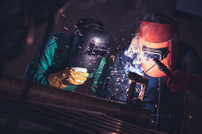 Men welding in workshop