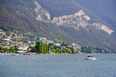 Scenic view of sea by buildings