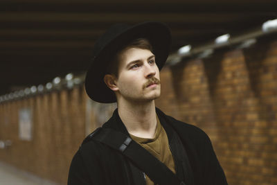 Portrait of young man standing outdoors