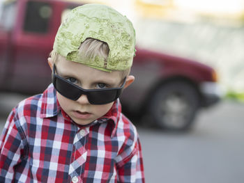 Portrait of boy wearing sunglasses and cap