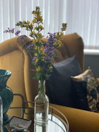 Flower vase on table at home