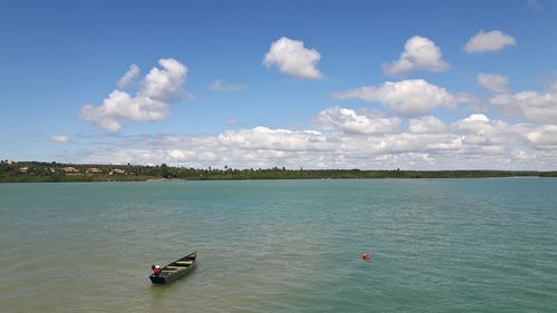 Boat on sea against sky