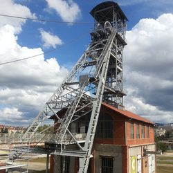 Low angle view of built structure against cloudy sky