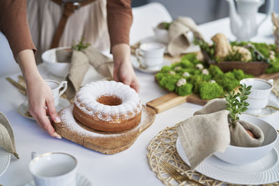 Midsection of woman holding food