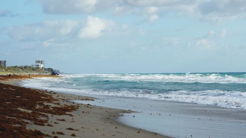 Scenic view of beach against sky