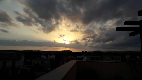 View of buildings against cloudy sky