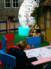 Close-up of woman sitting on bench