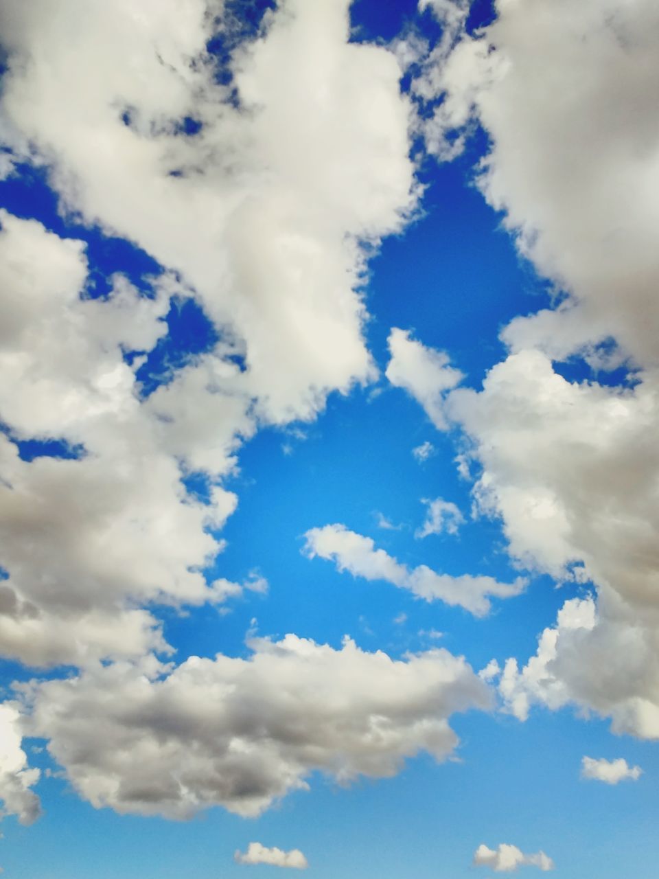 LOW ANGLE VIEW OF BLUE SKY AND CLOUDS