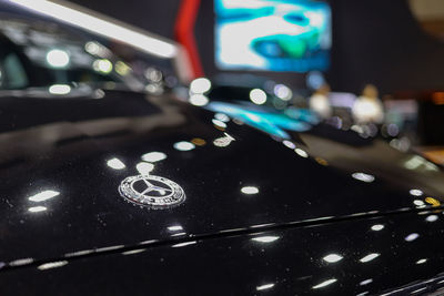 Close-up of illuminated car on road at night