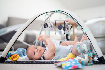 Portrait of cute baby boy sitting at home