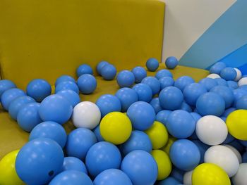 High angle view of multi colored balloons on table