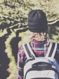 Rear view of woman sitting outdoors