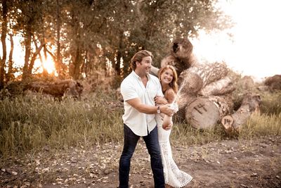 Young couple standing on field