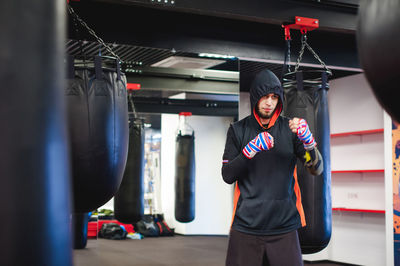 Man practicing in boxing ring