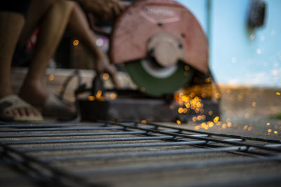 Close-up of person working on floor