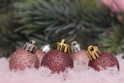 Close-up of christmas decorations on snow