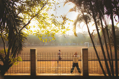 High angle view of mid adult man standing at park