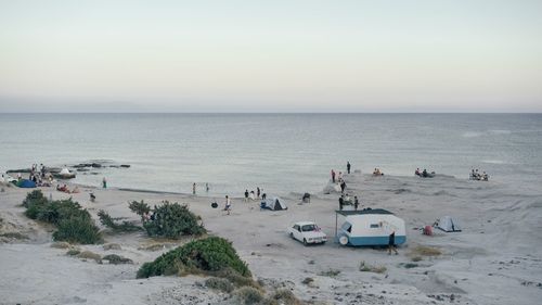 High angle view of people on beach against sky