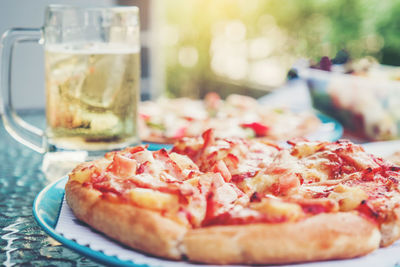 Close-up of pizza served on table
