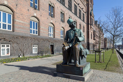 Rear view of woman standing on street