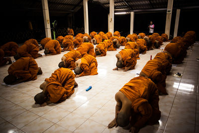 High angle view of people relaxing on floor