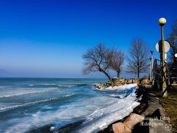 Scenic view of sea against clear sky during winter