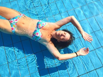 Girl lying in pool