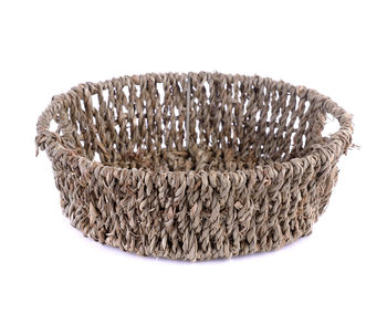 High angle view of wicker basket over white background