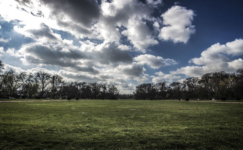 Scenic view of landscape against cloudy sky