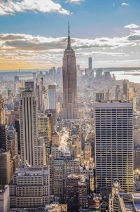 Skyscrapers in city against sky