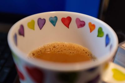 Close-up of coffee cup on table