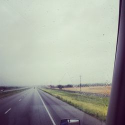 Road passing through car windshield