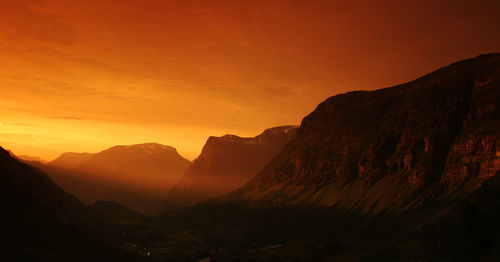 Scenic view of mountains against sky during sunset