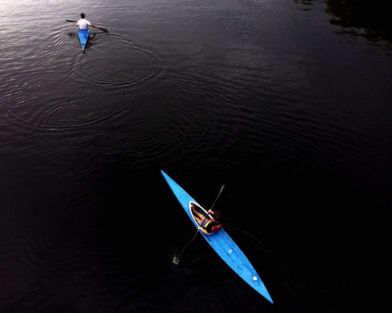 water, lifestyles, leisure activity, men, nautical vessel, transportation, boat, sea, mode of transport, travel, oar, high angle view, vacations, waterfront, weekend activities, person, sailing