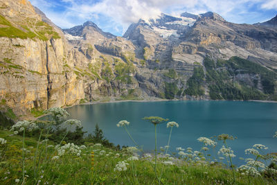 Scenic view of lake and mountains against sky