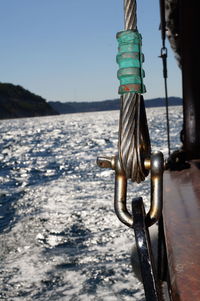 Close-up of rope on beach against sky