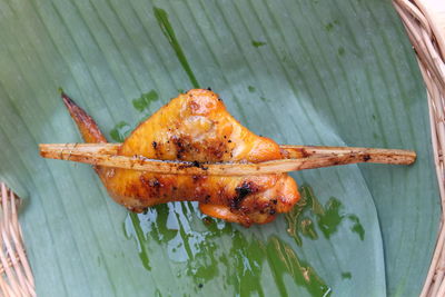 High angle view of meat on barbecue grill